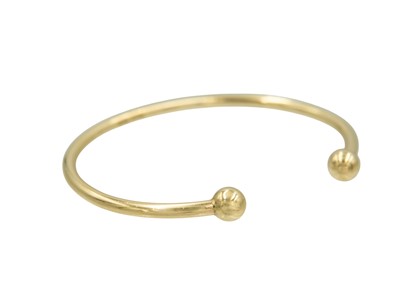 Lot 29 - A 9k solid gold gentleman's open bangle.