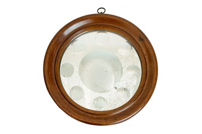 Lot 848 - A circular sorcerer mirror.