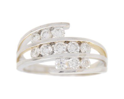 Lot 104 - A 14k white gold and diamond dress ring.