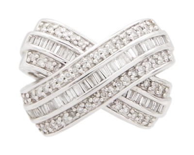 Lot 152 - A 14k white gold and diamond set cross-over pendant.