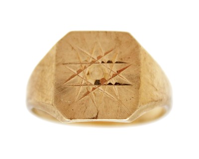 Lot 99 - A 9k gold signet ring with an engraved star.