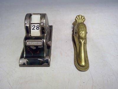 Lot 34 - A Vintage Desk Calendar and a Brass Duck Head...