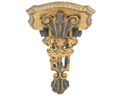 Lot 323 - A carved wood bracket shelf.