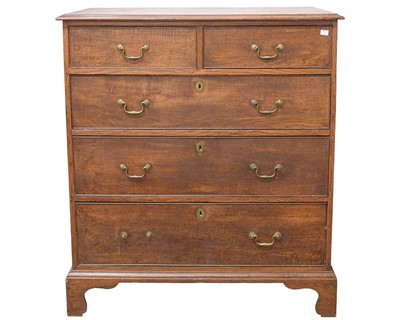 Lot 945 - A late George III oak chest.