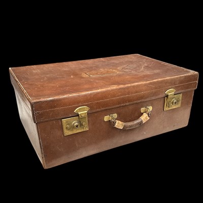 Lot 75 - A good quality leather suitcase with John...