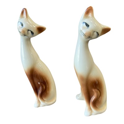 Lot 77 - Two ceramic Siamese cat Figurines. 26cm high.