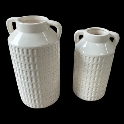 Lot 82 - Two White embossed ceramic Churn Vases with...