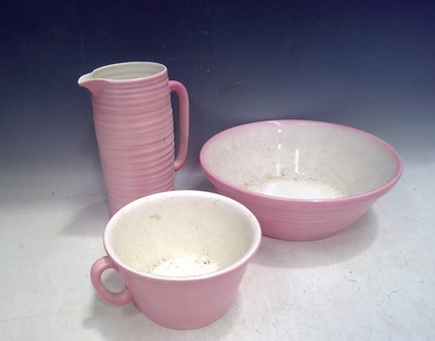 Lot 103 - A Dressing Table Set in Pink. The Jug is 28cm...