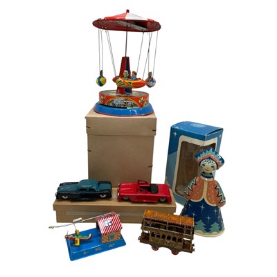 Lot 108 - A Vintage Tin Toy Carousel ( 20cm high) in...