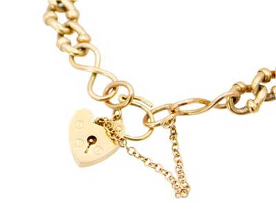 Lot 162 - A 9k fancy oval link bracelet with padlock clasp.