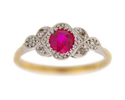 Lot 6 - A 9k gold with platinum, ruby, and diamond ring.