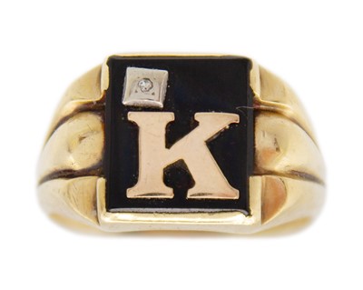 Lot 201 - A 10k gold, black onyx, and diamond signet ring.