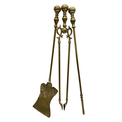 Lot 151 - A Brass Fireside Companion Set. 65cm long.