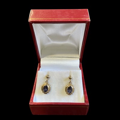 Lot 164 - A pair of 9ct gold and amethyst earrings.