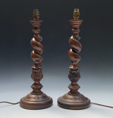 Lot 83 - A pair of oak barley twist and acanthus design...