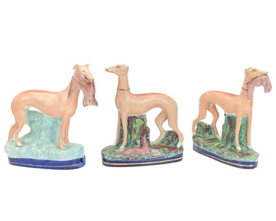 Lot 632 - A pair of Victorian Staffordshire greyhounds.