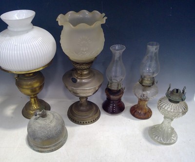 Lot 77 - A Selection of Oil Lamps and Glass Shades. The...