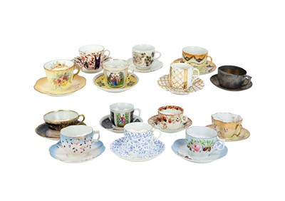 Lot 649 - A collection of moustache cups and saucers.