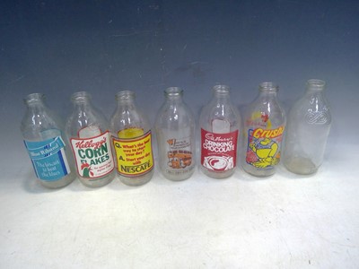 Lot 104 - Thirteen Vintage Advertising Milk Bottles.