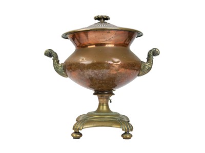 Lot 60 - A 19th century copper samovar with scrolled twin handles.