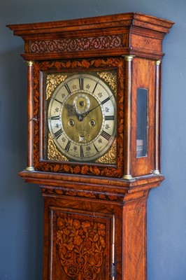 Lot 792 - A walnut and marquetry inlaid eight day longcase clock.
