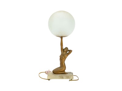 Lot 678 - An Art Deco gilded spelter lamp in the form of a female nude.