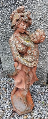 Lot 773 - An early 20th century terracotta garden sculpture of a mother holding her child.