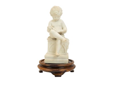 Lot 144 - A 19th century Parian ware figure of a child reading a book.