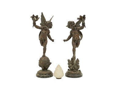 Lot 126 - A pair of early 20th century table lamps modelled as cherubs holding torches.