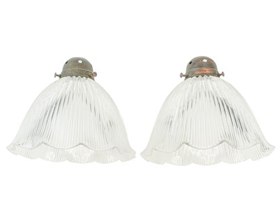 Lot 254 - A pair of Holophane glass pendant lights.