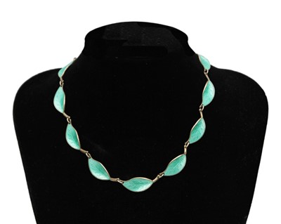 Lot 109 - DAVID ANDERSEN, NORWAY - a silver and green enamel leaf panel necklace.