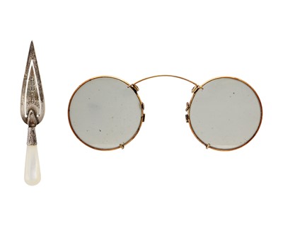 Lot 120 - A Victorian silver and mother-of-pearl trowel bookmark, and a pair of gold-plated spectacles.