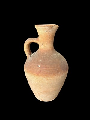 Lot 92 - A terracotta jug, unmarked, similar in style...