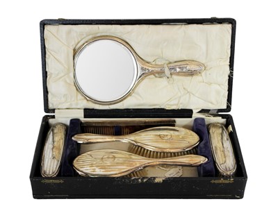 Lot 144 - A cased George V silver six-piece dressing table set.