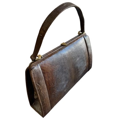 Lot 138 - A Snake/Lizard skin German handbag.
