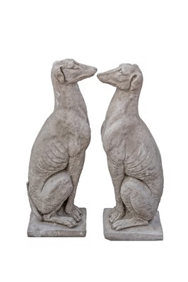 Lot 770 - A pair of cast stone sculptures of seated whippets.