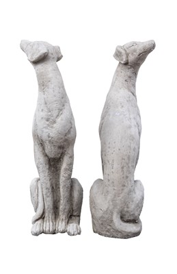 Lot 742 - A pair of cast stone sculptures of seated whippets.