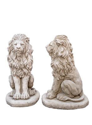 Lot 743 - A pair of cast stone sculptures of seated lions.