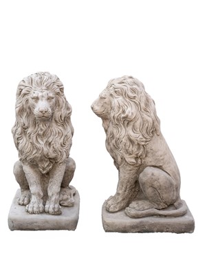 Lot 779 - A pair of cast stone sculptures of seated lions.