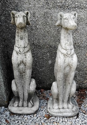 Lot 443 - A pair of large reconstituted stone sculptures of seated greyhounds.