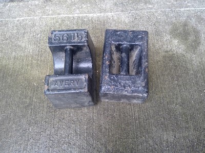 Lot 168 - Two Vintage 56lb weights.