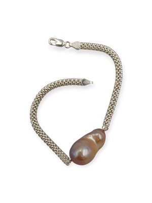 Lot 46 - A silver mesh bracelet, applied to a large cultured baroque pearl.