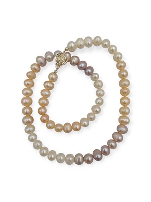 Lot 48 - A golden, white, and pinkish-purple cultured pearl necklace.
