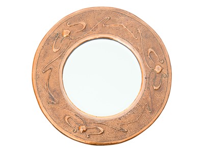 Lot 817 - An Arts and Crafts circular copper mirror.