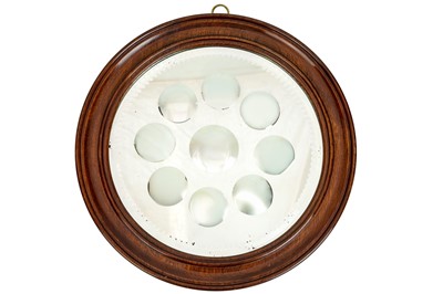Lot 850 - A mahogany framed sorcerer's mirror.