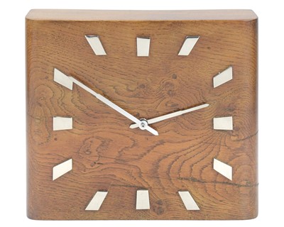 Lot 793 - A stylish oak mantel clock.