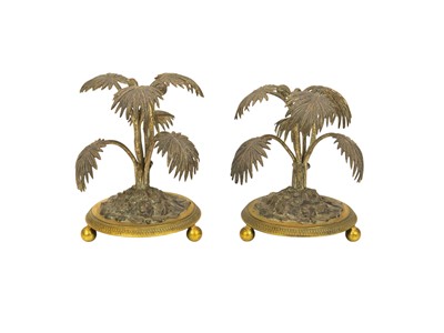 Lot 9 - A pair of silver plated and gilt metal palm tree table ornaments.