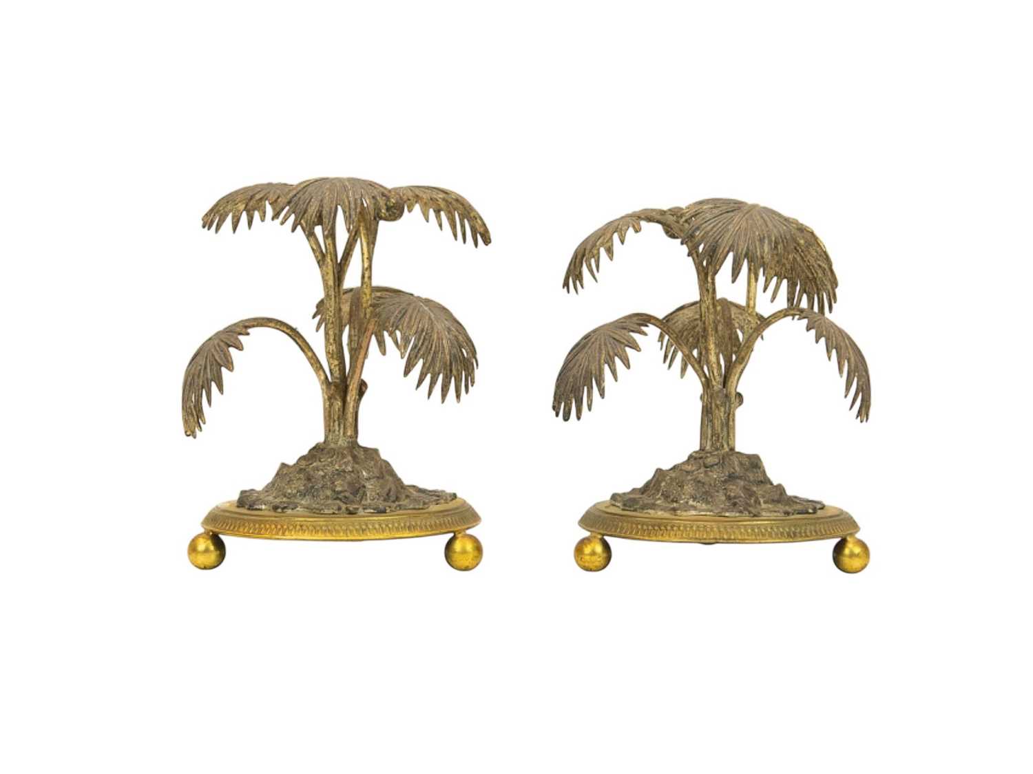 Lot 9 - A pair of silver plated and gilt metal palm tree table ornaments.