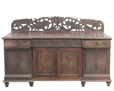 Lot 919 - An Anglo-Indian carved hardwood sideboard.