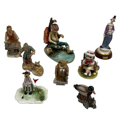 Lot 236 - A collection of figurines, including Epoca,...